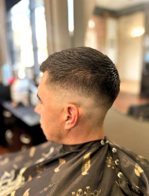 Low fade haircut with styled top